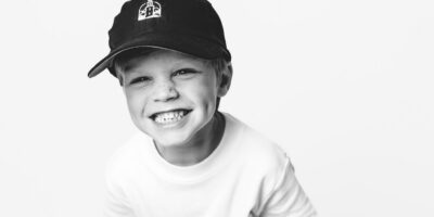 Child smiling in William L. Edwards Dentistry hat for family dental care in Rome GA