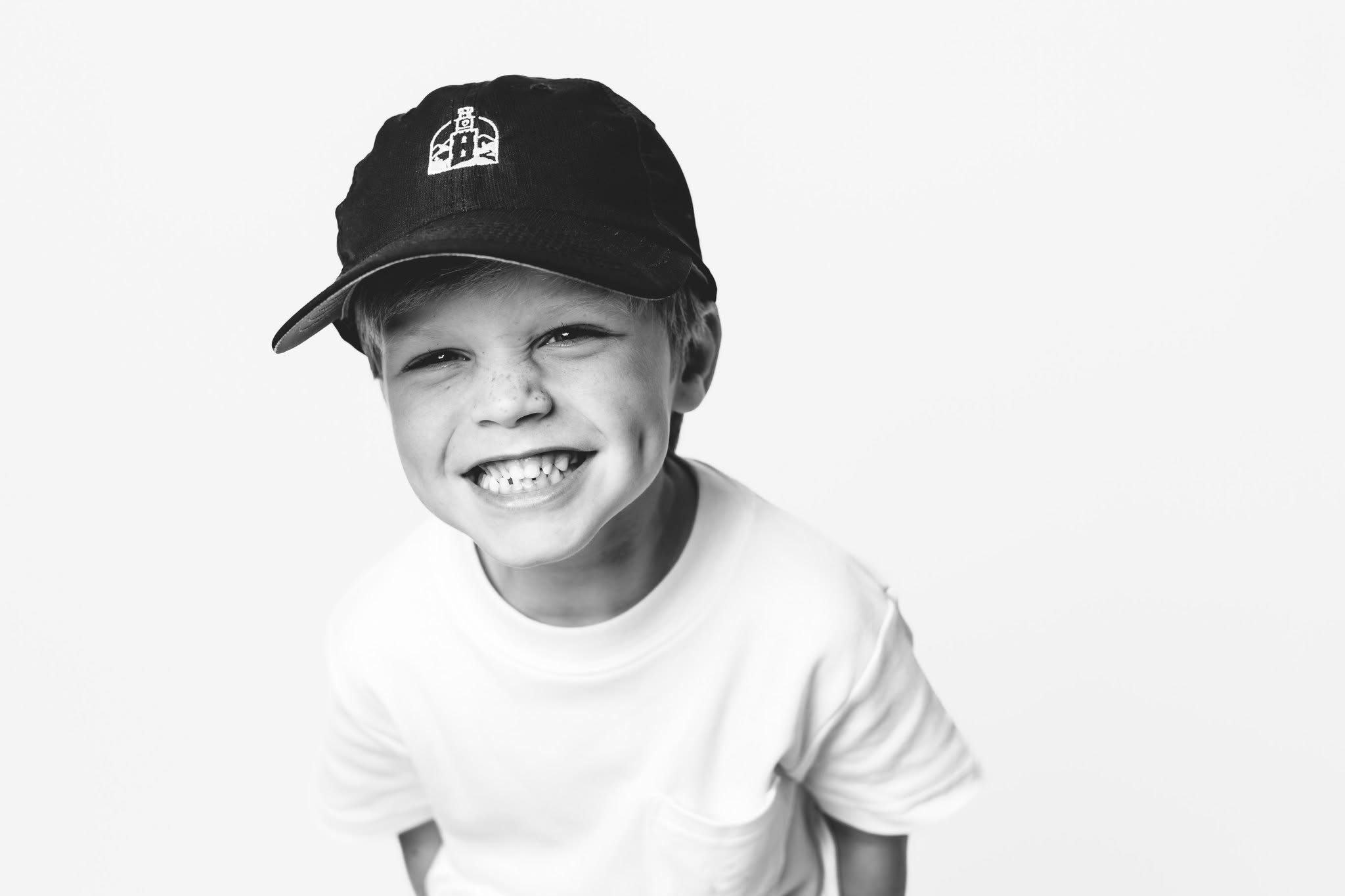 Child smiling in William L. Edwards Dentistry hat for family dental care in Rome GA